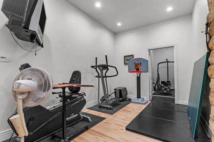 Hardwood-style flooring with recessed lighting