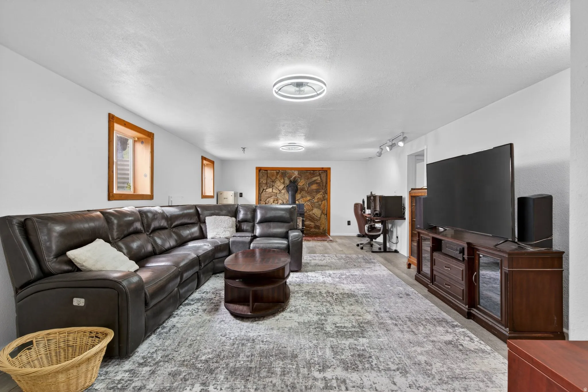 Spacious interior featuring light-colored walls and recessed lighting