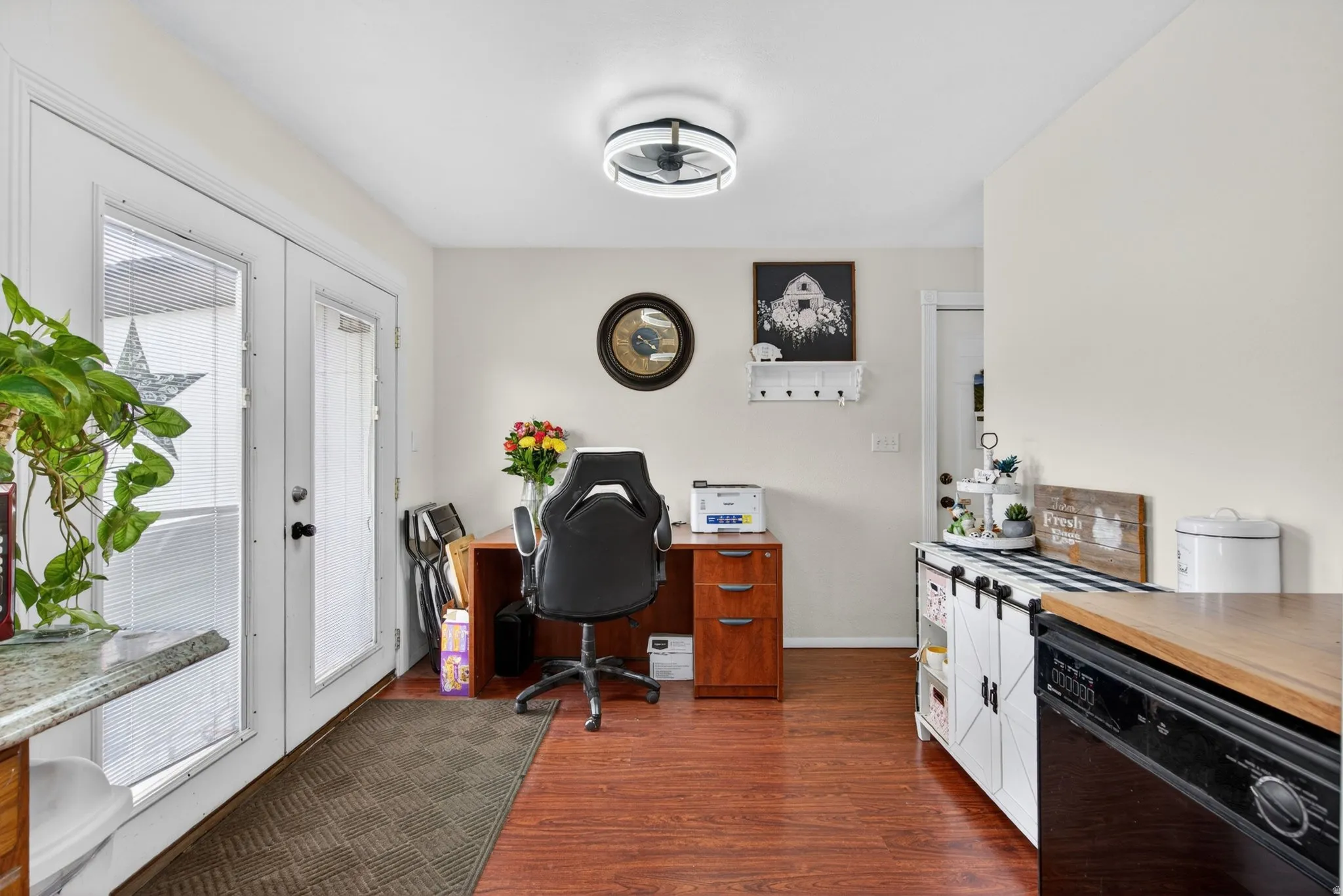 Bright interior space featuring wood-finish flooring and neutral wall tones