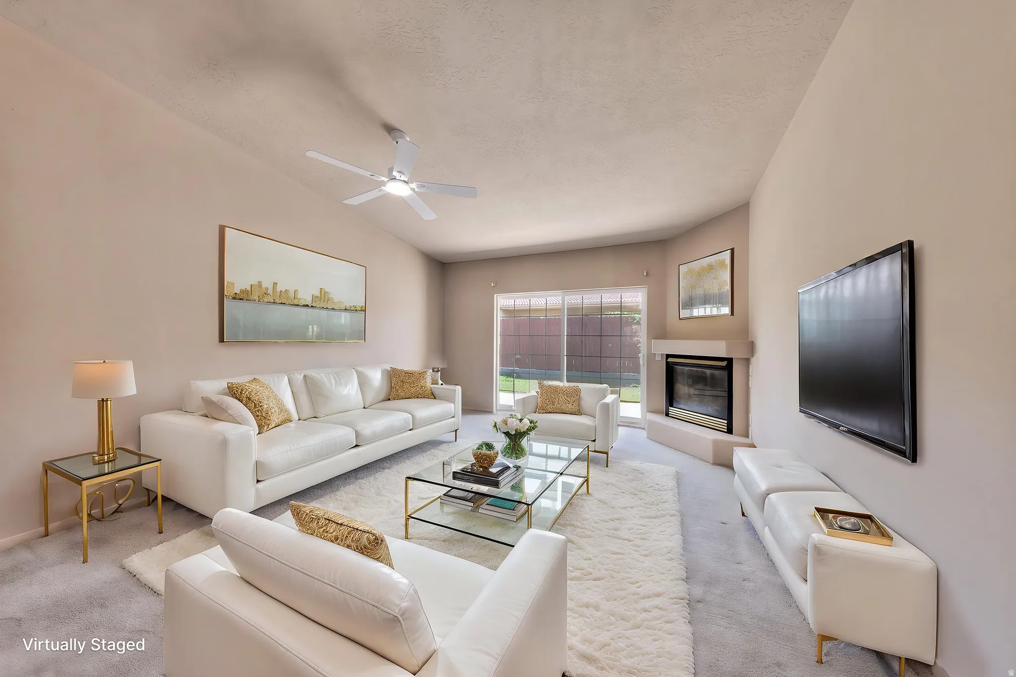 Living room featuring a vaulted ceiling with a ceiling fan, a fireplace with a mantel, and sliding glass doors