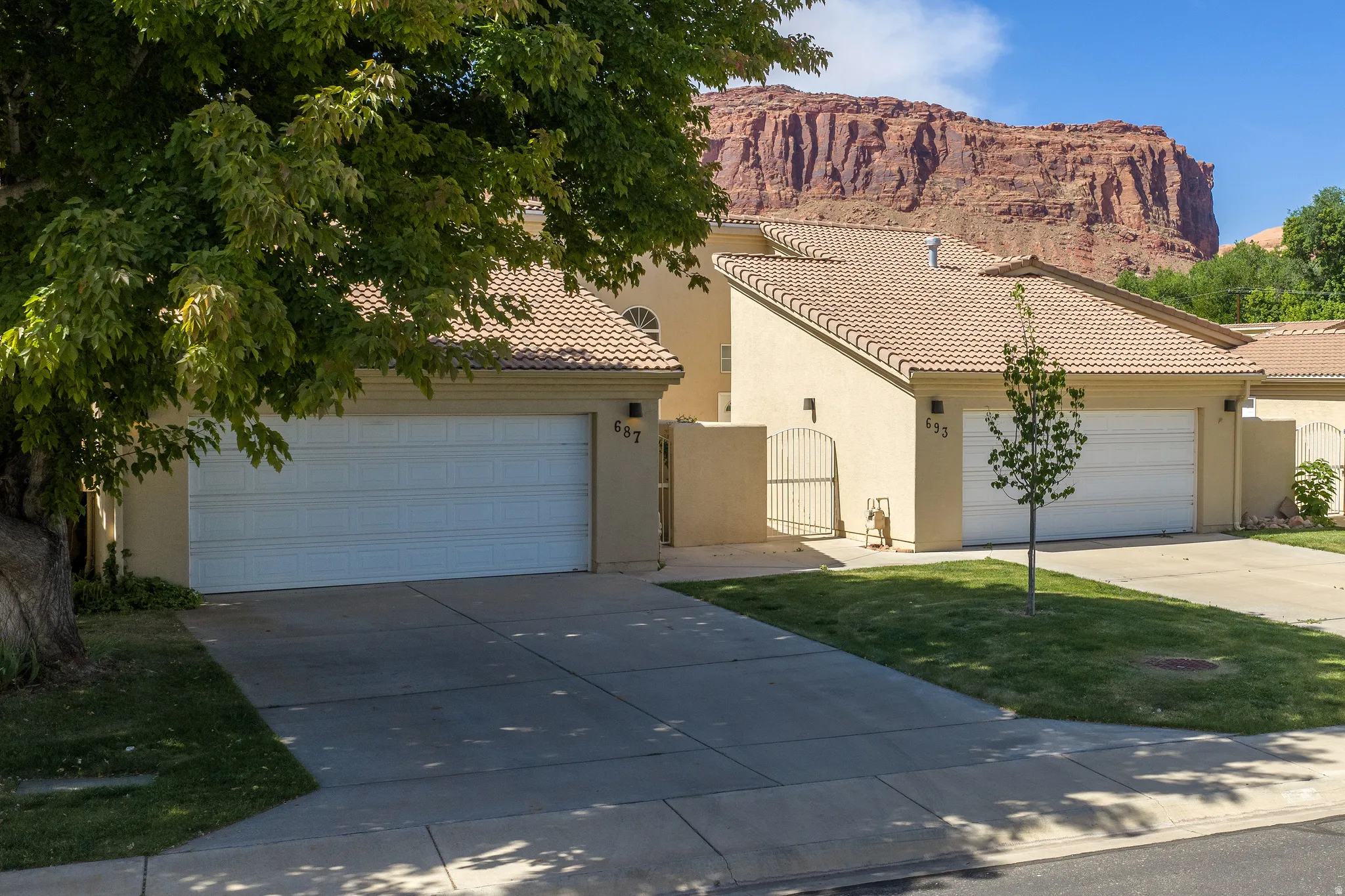 Southwest-style residences featuring stucco exteriors and tile roofs