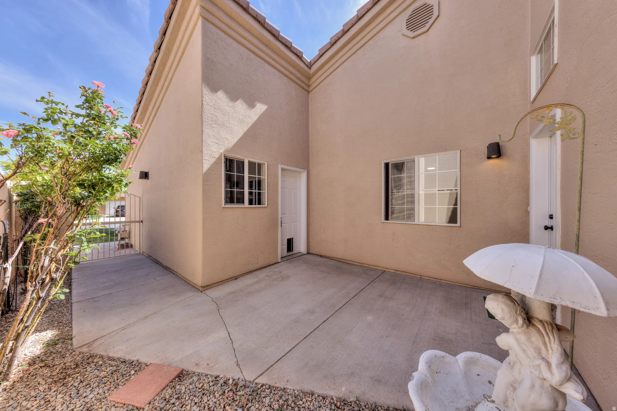 Exterior patio space with concrete flooring