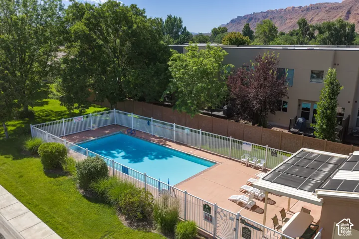 Rectangular outdoor swimming pool with surrounding patio decking