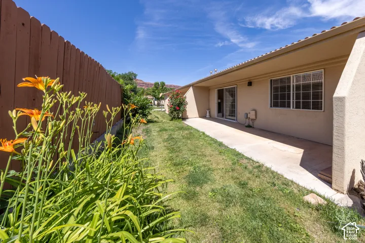 Expansive concrete patio with direct access via a glass sliding door