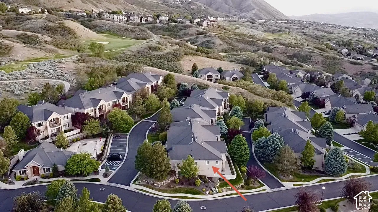 Aerial perspective showcasing a residential community with multi-story buildings and single-level structures