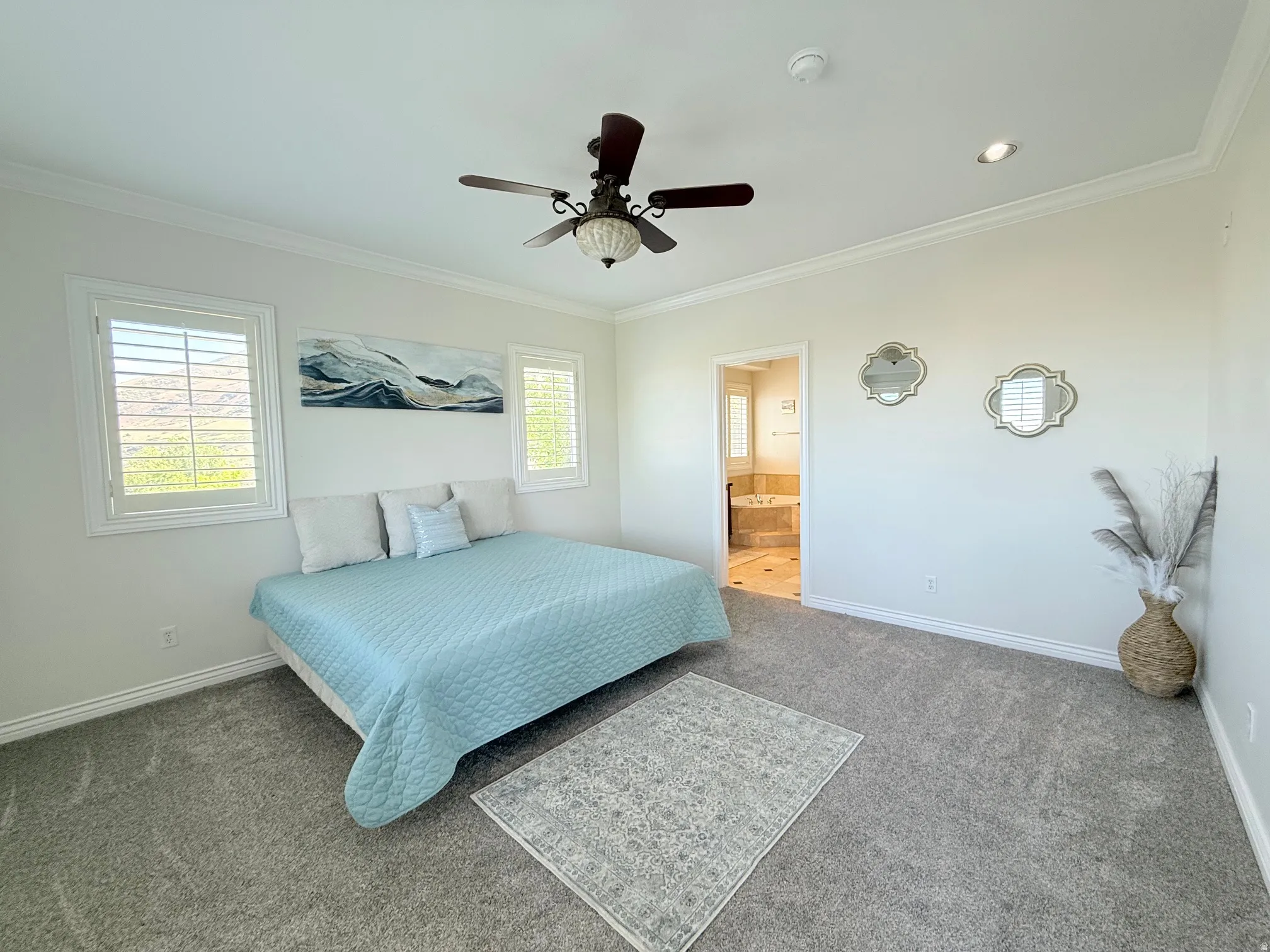 Carpeted room with crown molding, a ceiling fan, and recessed lighting