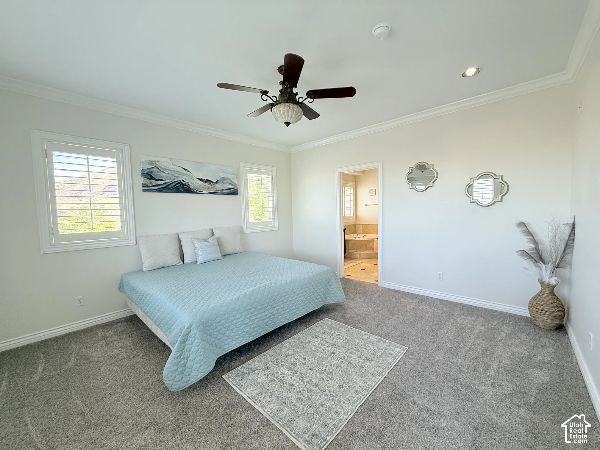 Carpeted room with crown molding, a ceiling fan, and recessed lighting