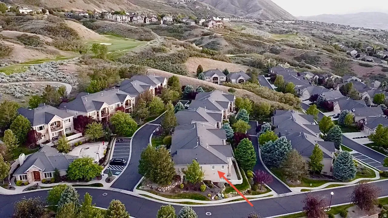 Aerial perspective showcasing a residential community with multi-story buildings and single-level structures