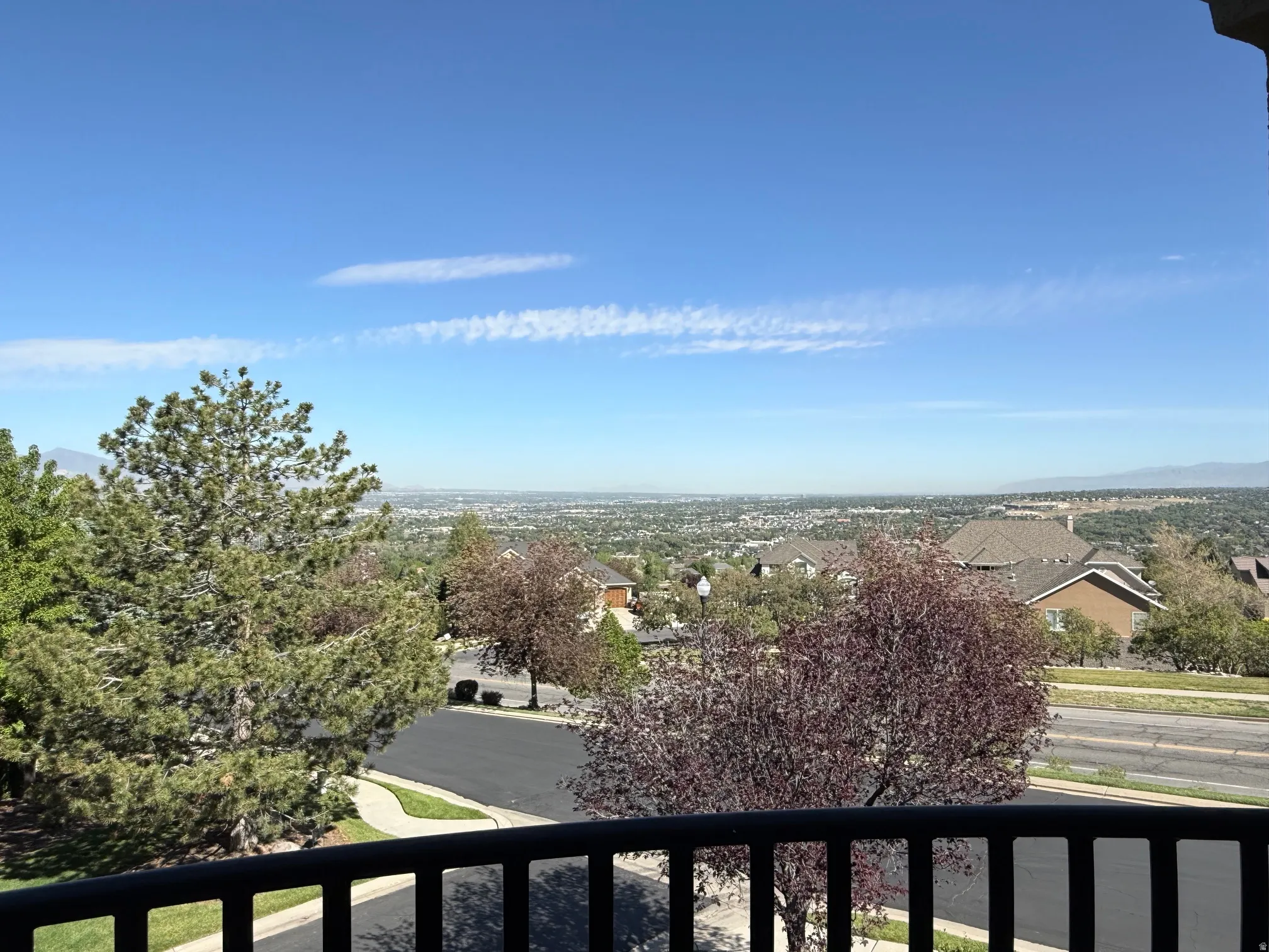 Expansive mountain and city scenery from a private balcony