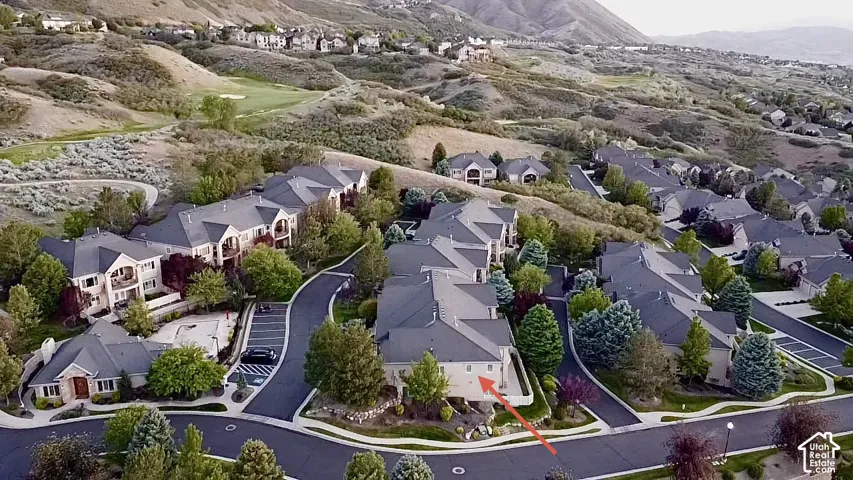 Aerial perspective showcasing a residential community with multi-story buildings and single-level structures