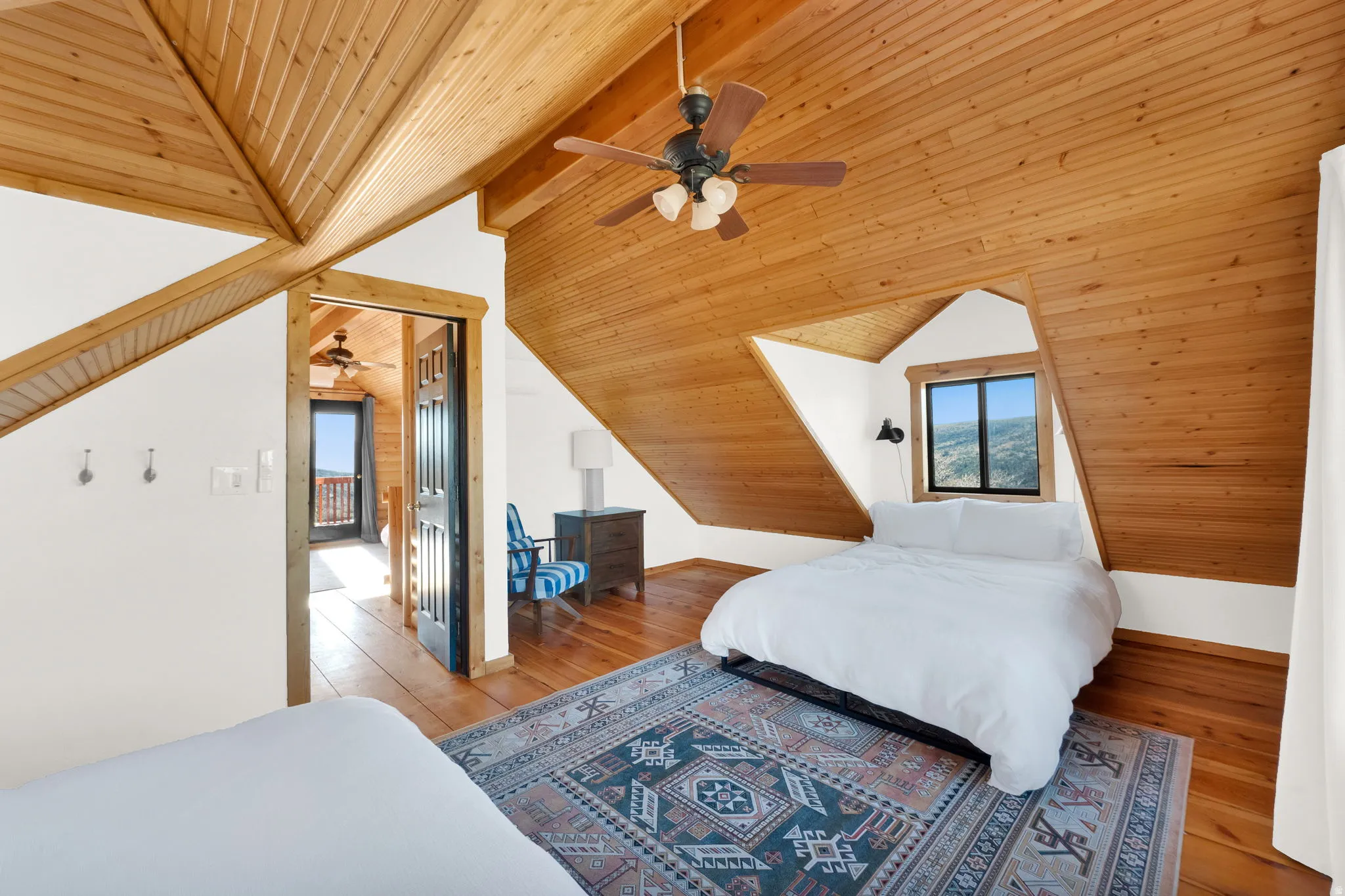 Vaulted wood-paneled ceiling with exposed beams