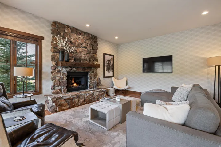 Stone fireplace with a substantial timber mantel