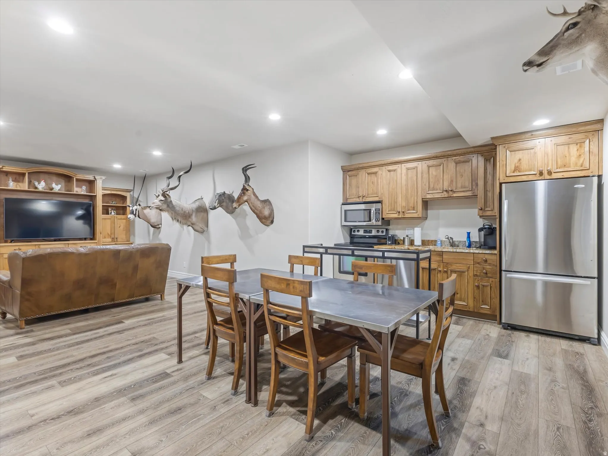 Open concept kitchen and living area in basement