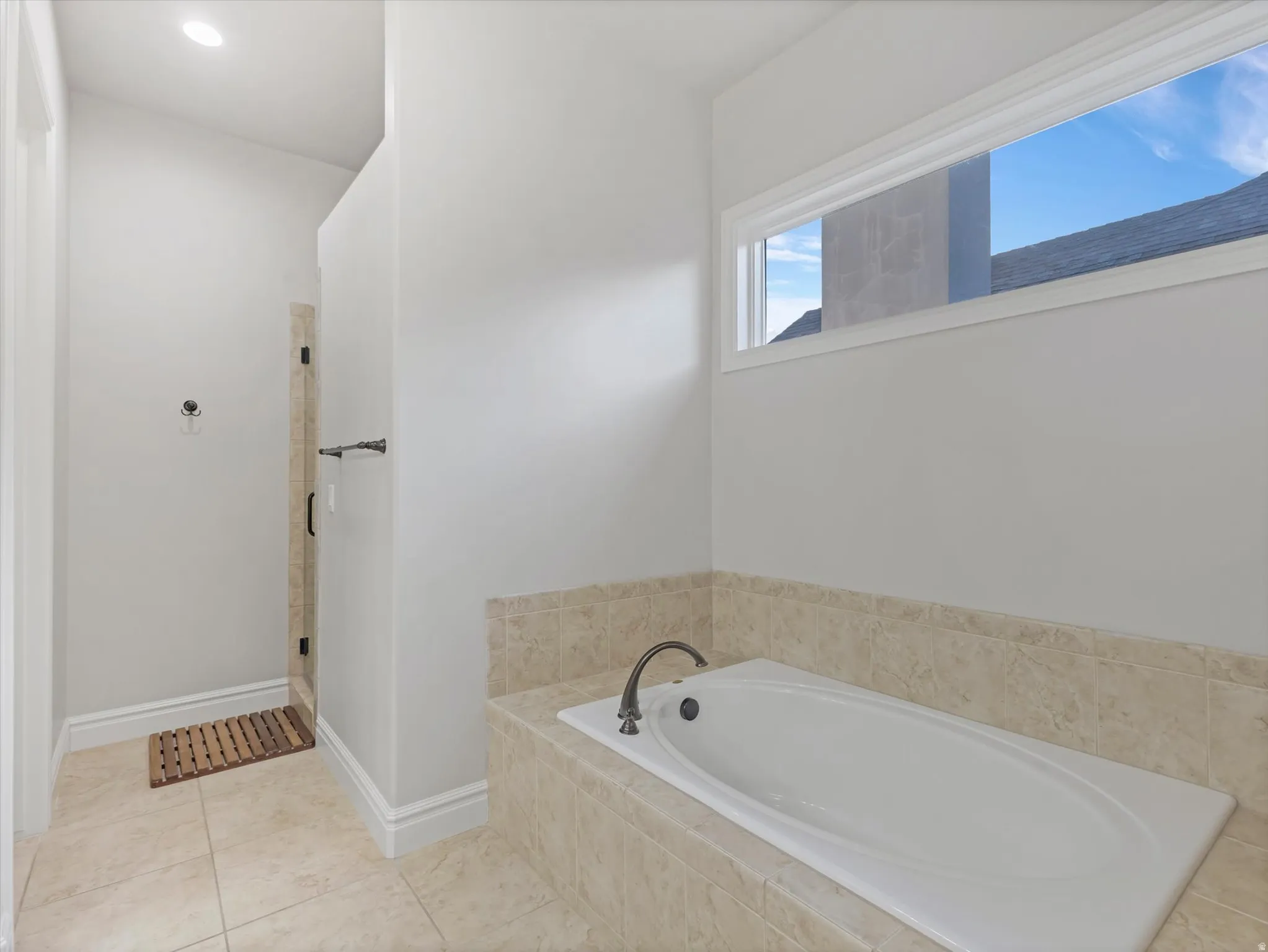 Ensuite bathroom with separate tub and shower