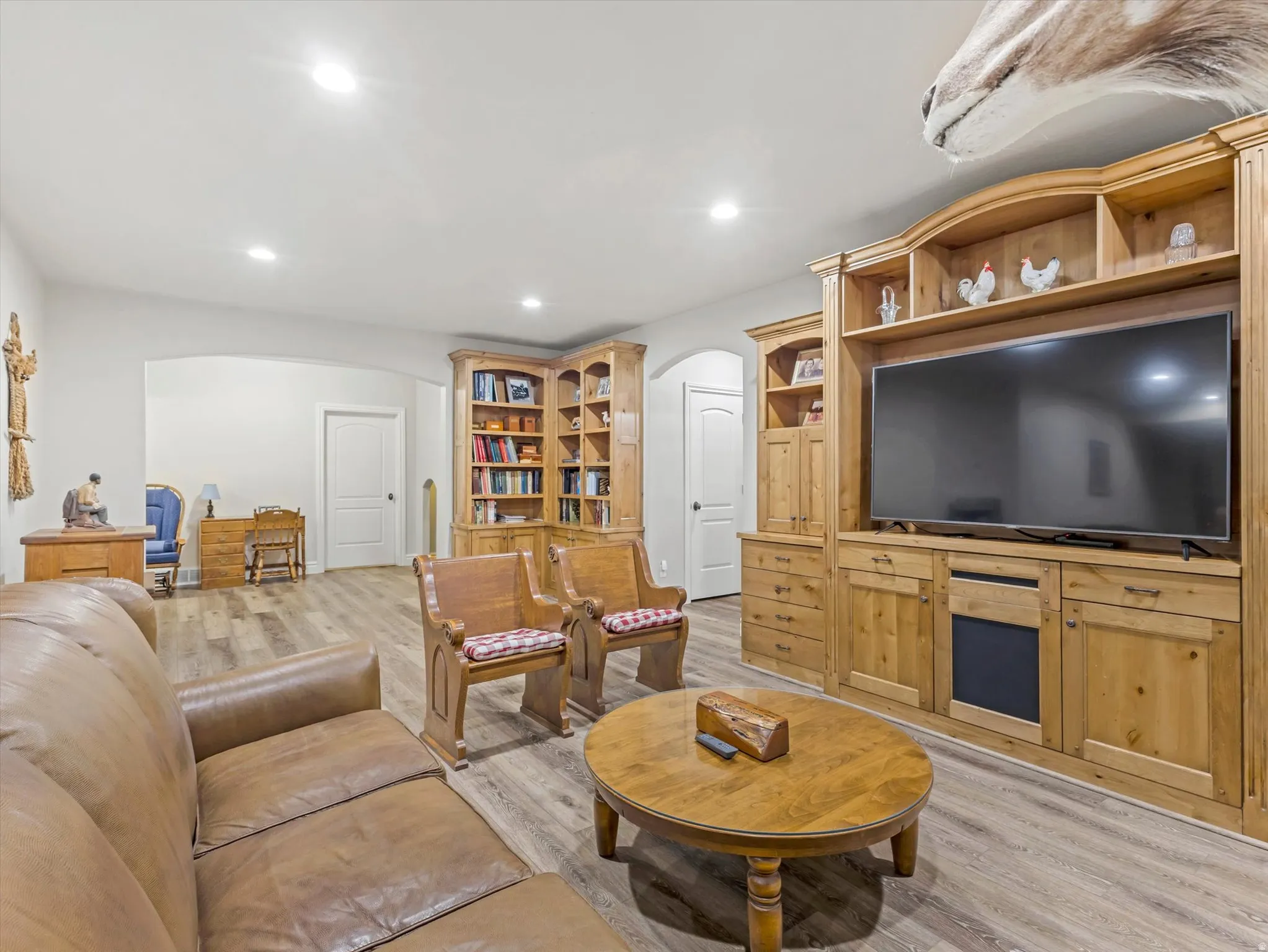 Built in entertainment center and book case in great room in basement