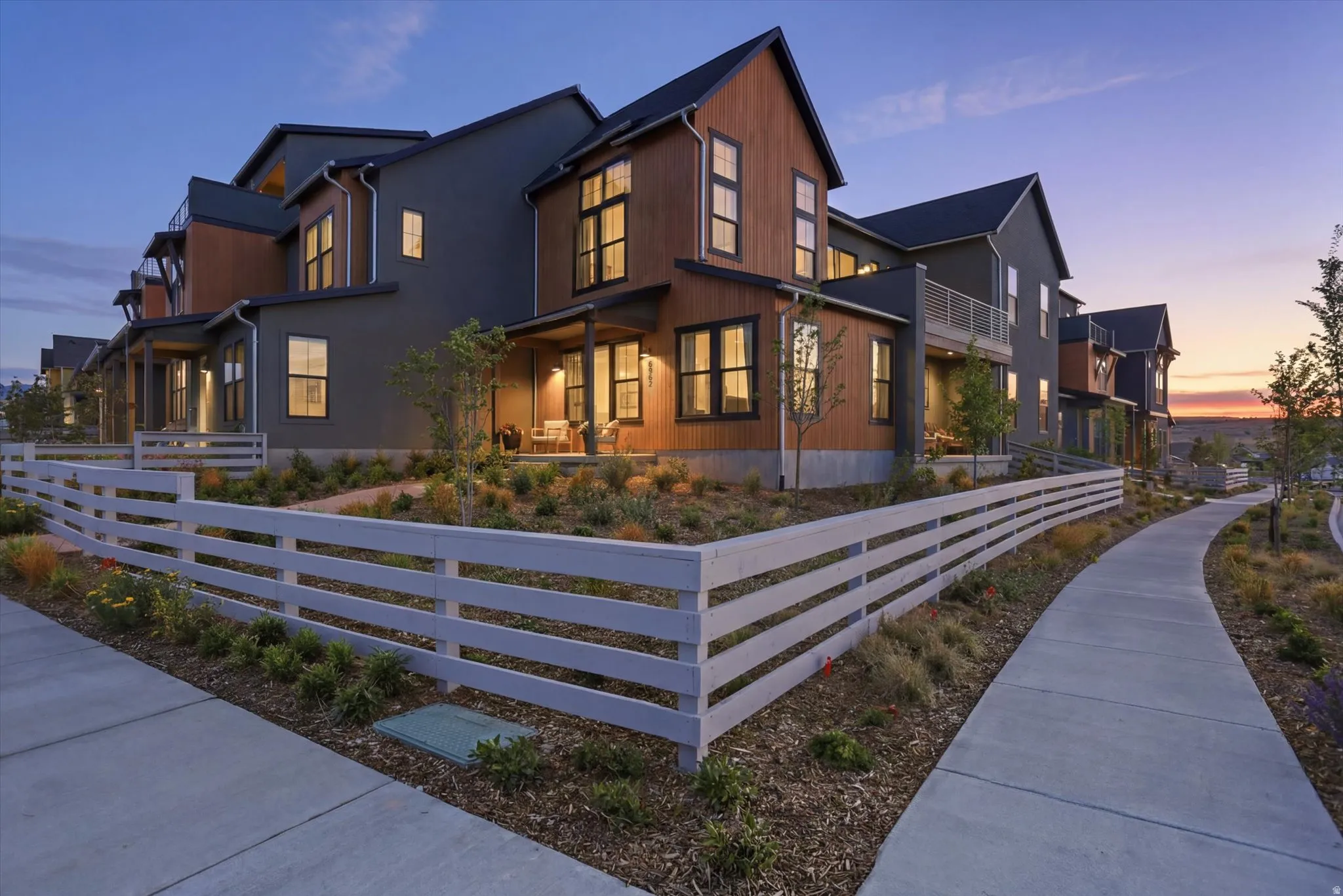 Contemporary architectural design featuring a combination of dark siding and wood-finish paneling