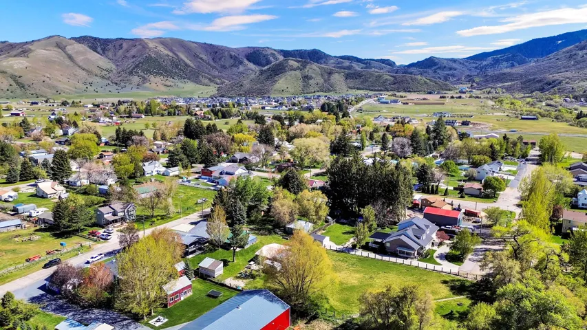 Expansive aerial perspective showcasing a residential community nestled within a valley