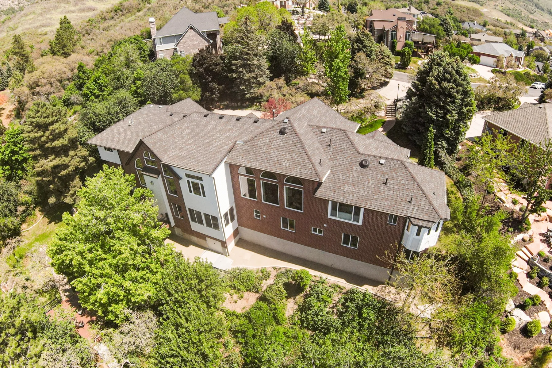 Expansive multi-level residence with a shingle roof