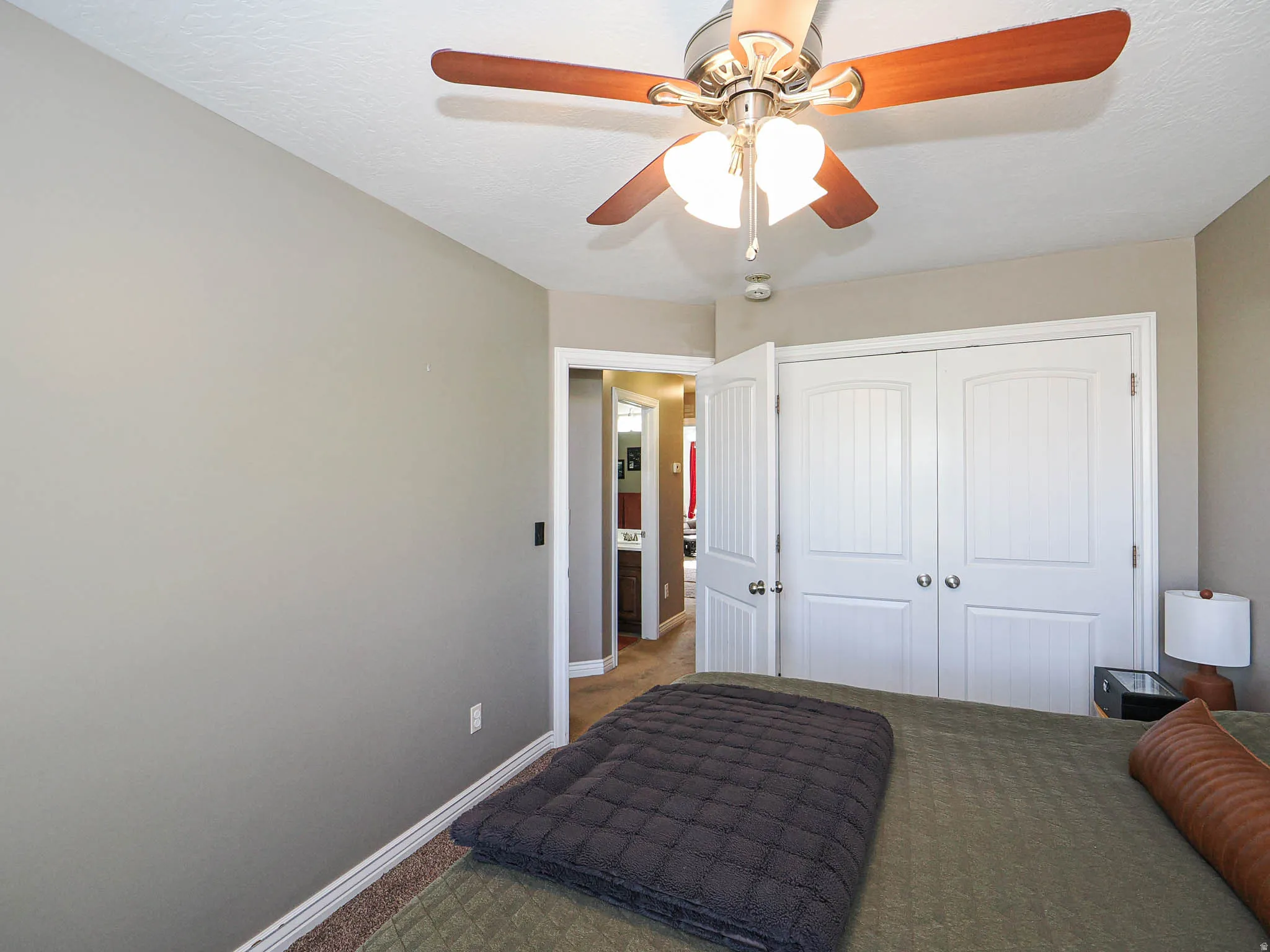 Neutral-toned walls and carpeted flooring define this interior space
