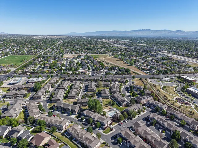 Expansive residential area with a clear sky backdrop and distant mountain range