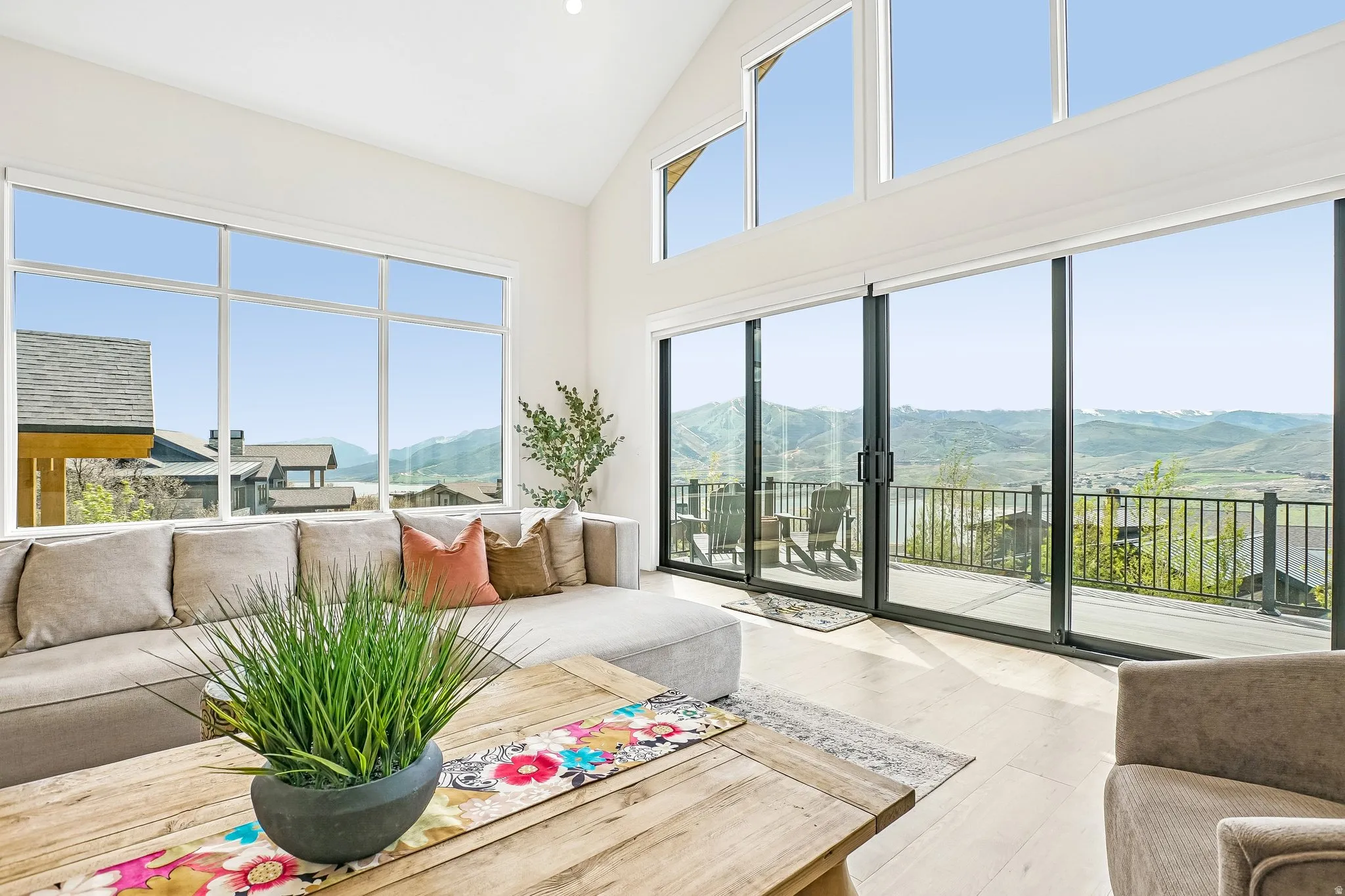 Vaulted ceilings featuring expansive windows
