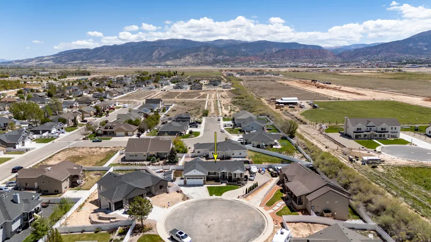 Aerial perspective showcasing a residential development with mountain backdrop
