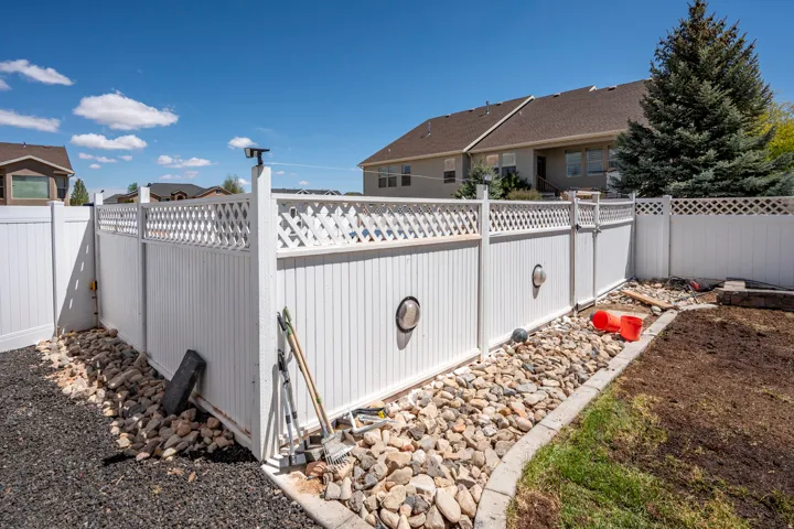 White panel fencing with lattice top accents