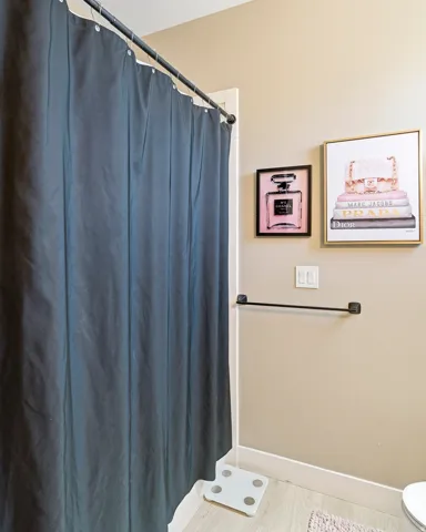 Light-toned wall paint complements the light wood-finish flooring