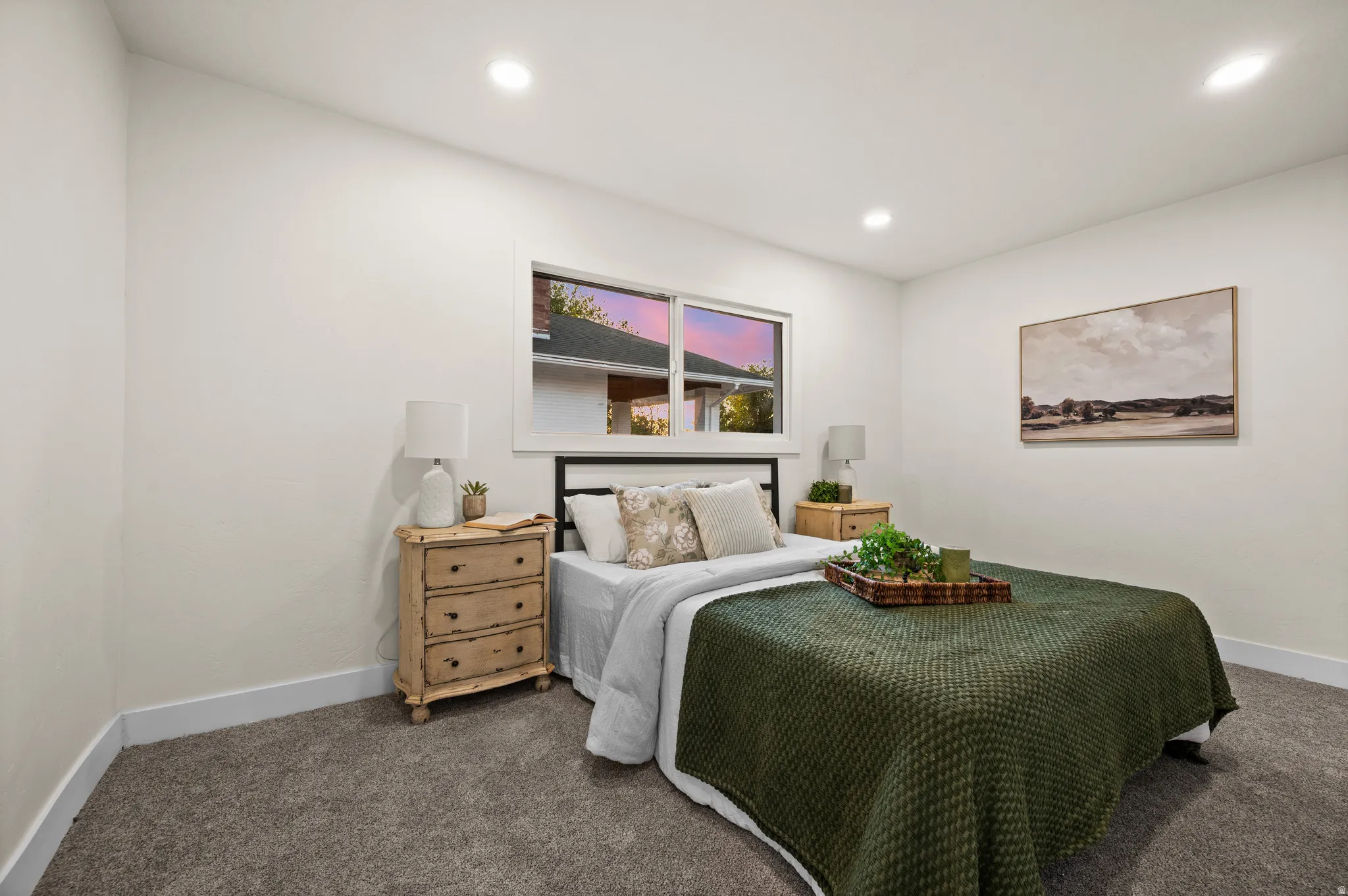 Bedroom featuring plush gray carpet, a white framed window, recessed lighting, and white baseboards