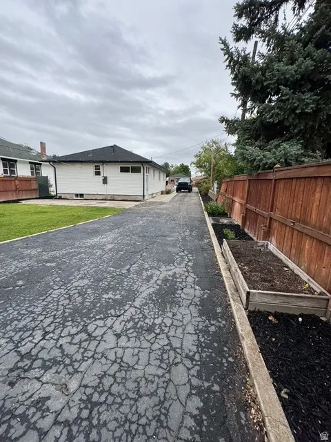 Long asphalt driveway providing extensive off-street parking