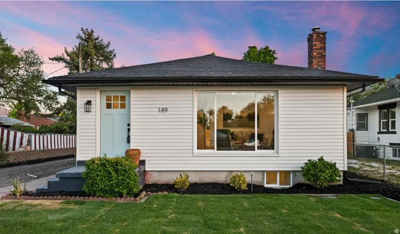 White horizontal siding exterior with a slate-tone roof