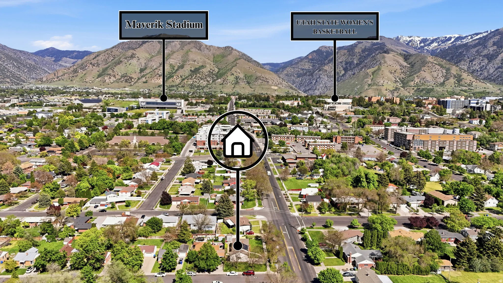 Aerial overview of a residential neighborhood with a mountainous backdrop, featuring established streets and mature trees