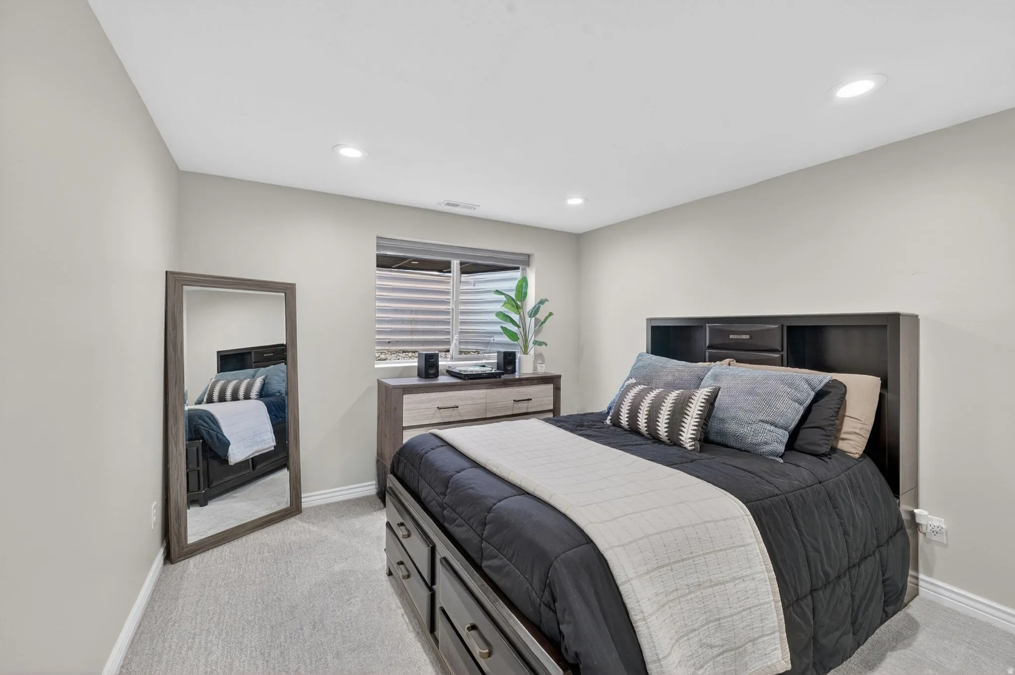 Neutral wall tones complement plush carpeting