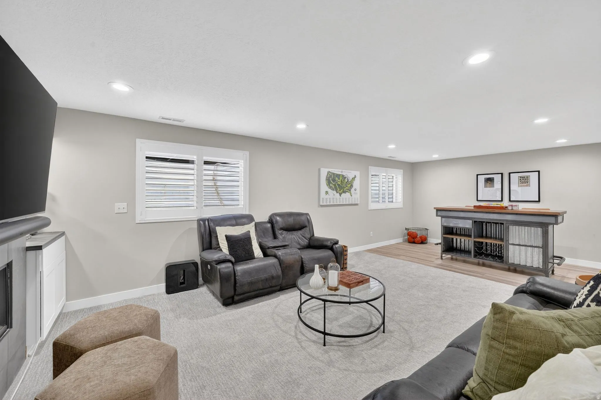 Spacious recreational area featuring recessed lighting and neutral wall tones