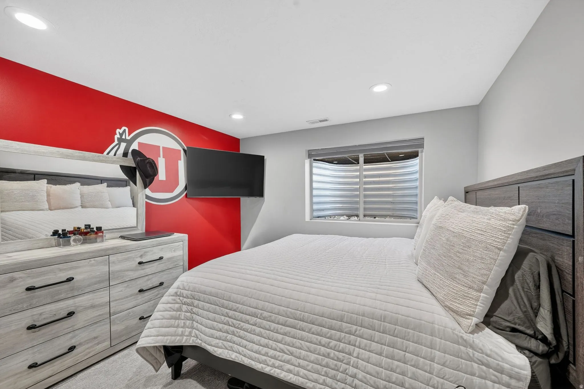 Bedroom featuring recessed lighting, a window with horizontal blinds, and carpeted flooring