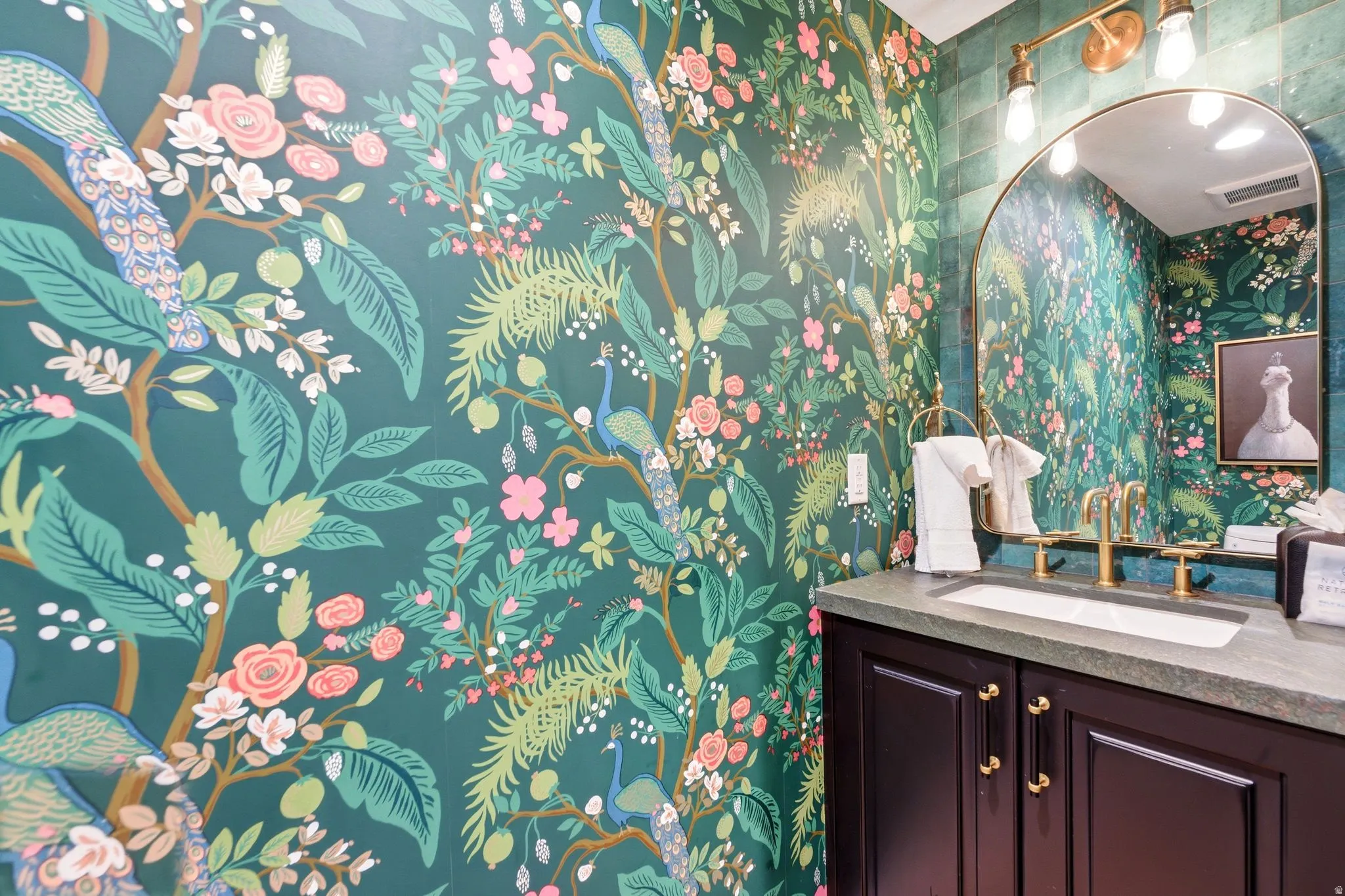 Vibrant botanical wallpaper with peacock accents