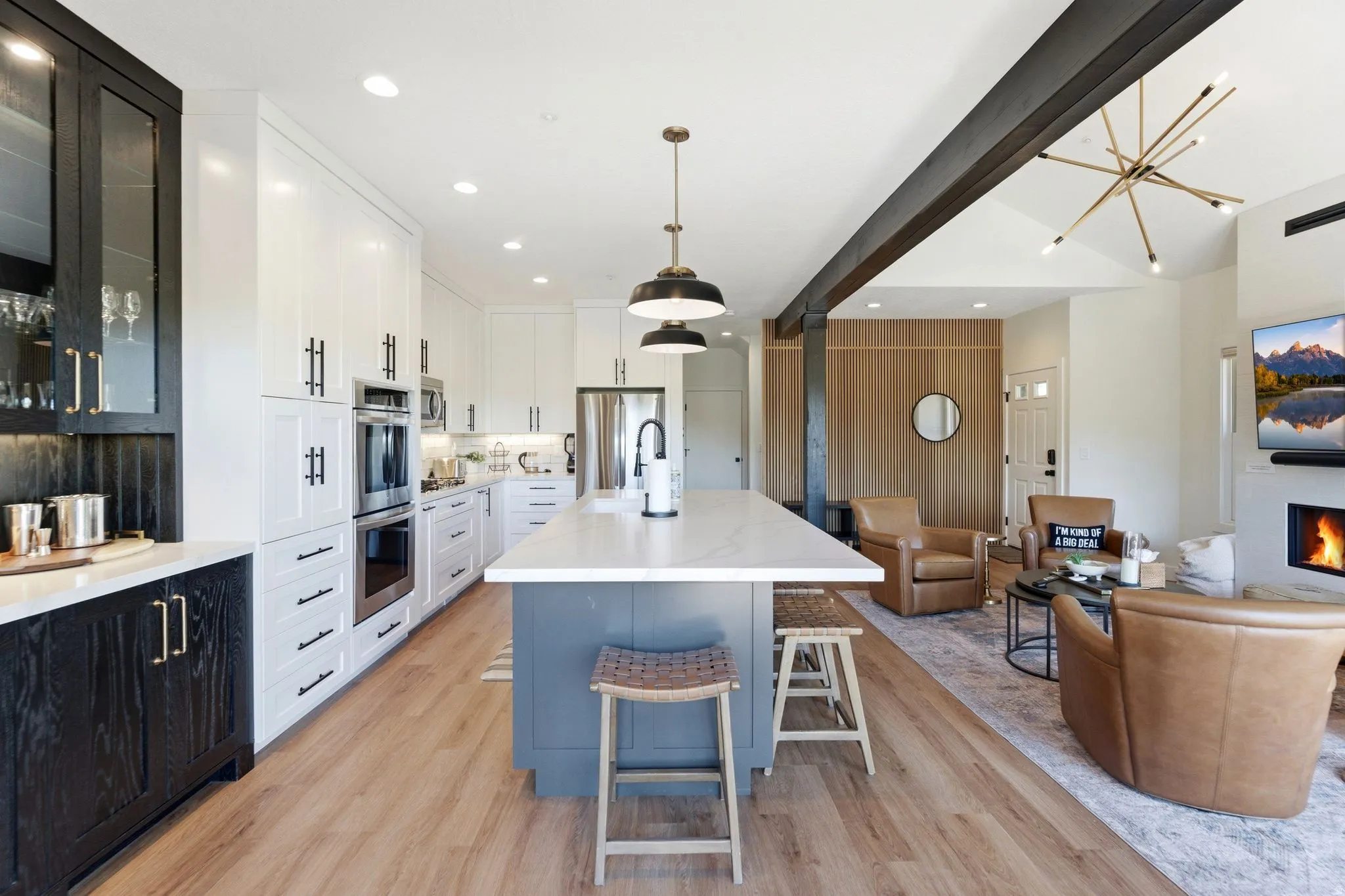 Open-concept living space featuring wood-finish flooring throughout