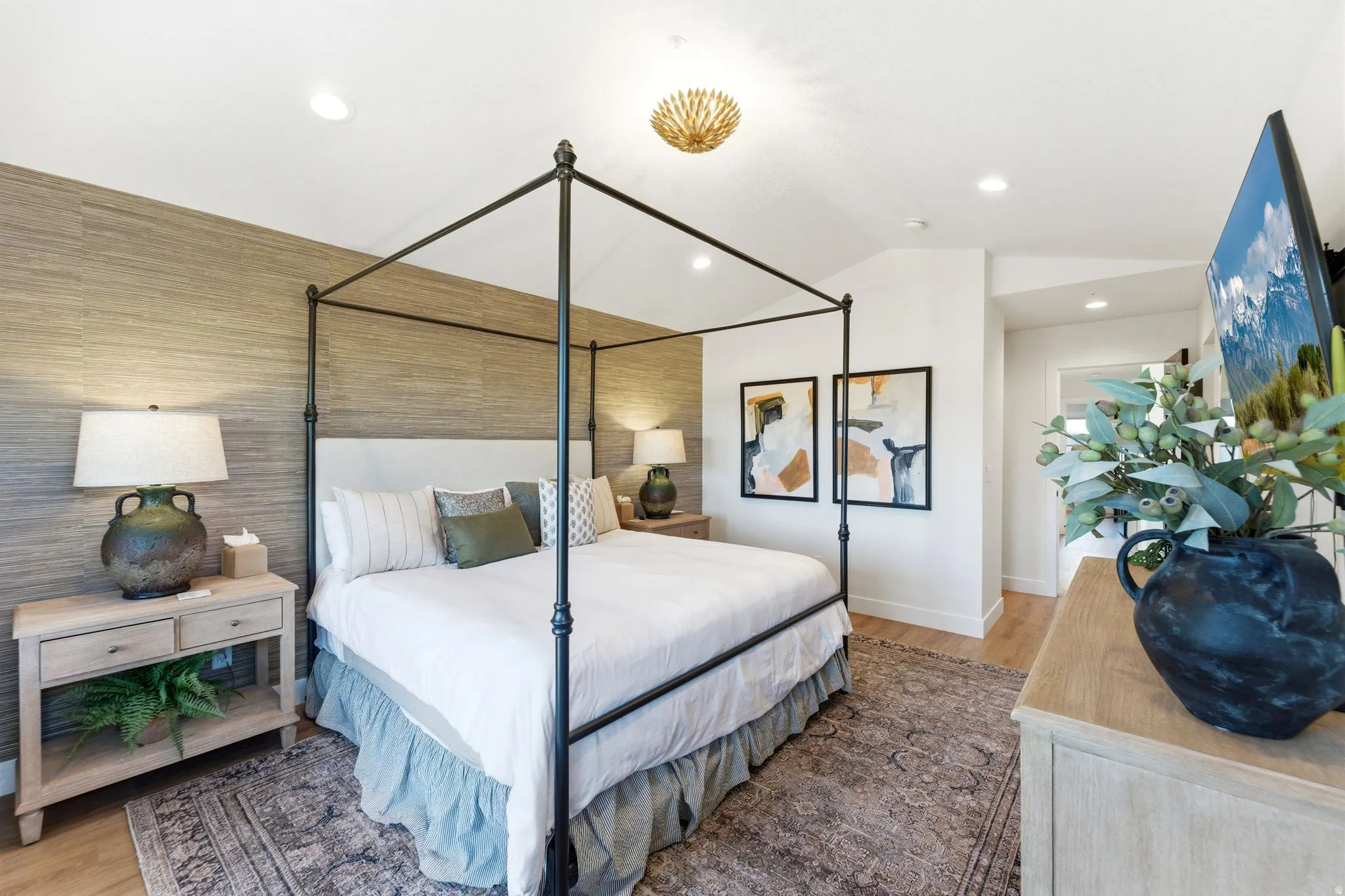 Bedroom featuring wood-finish flooring, recessed lighting, and a textured accent wall