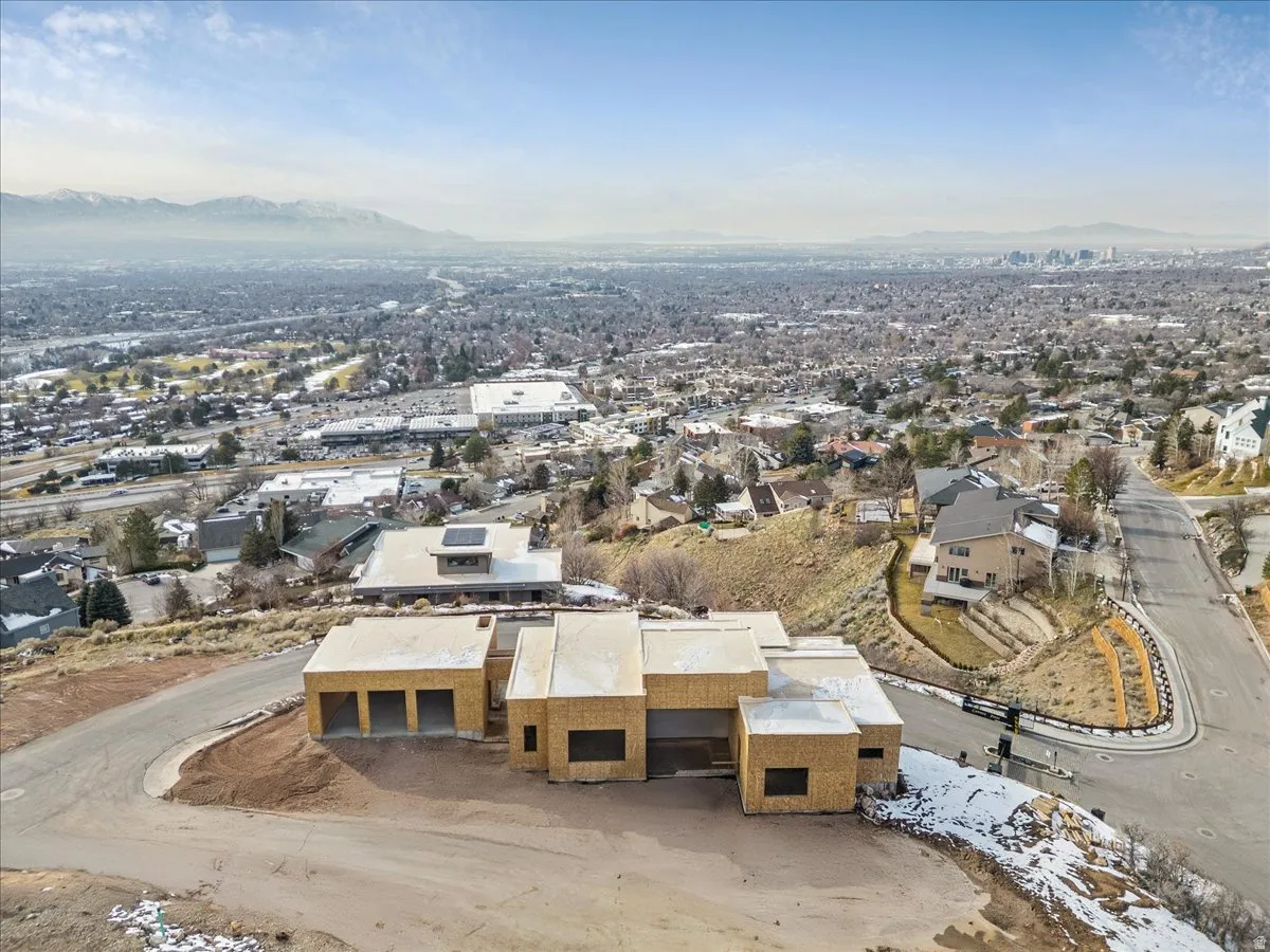 Property under construction featuring a multi-car garage, contemporary architectural design, and a flat roofline