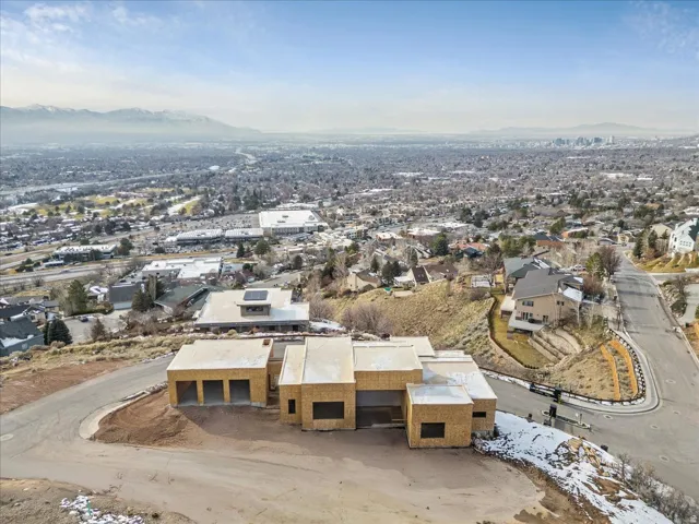 Property under construction featuring a multi-car garage, contemporary architectural design, and a flat roofline