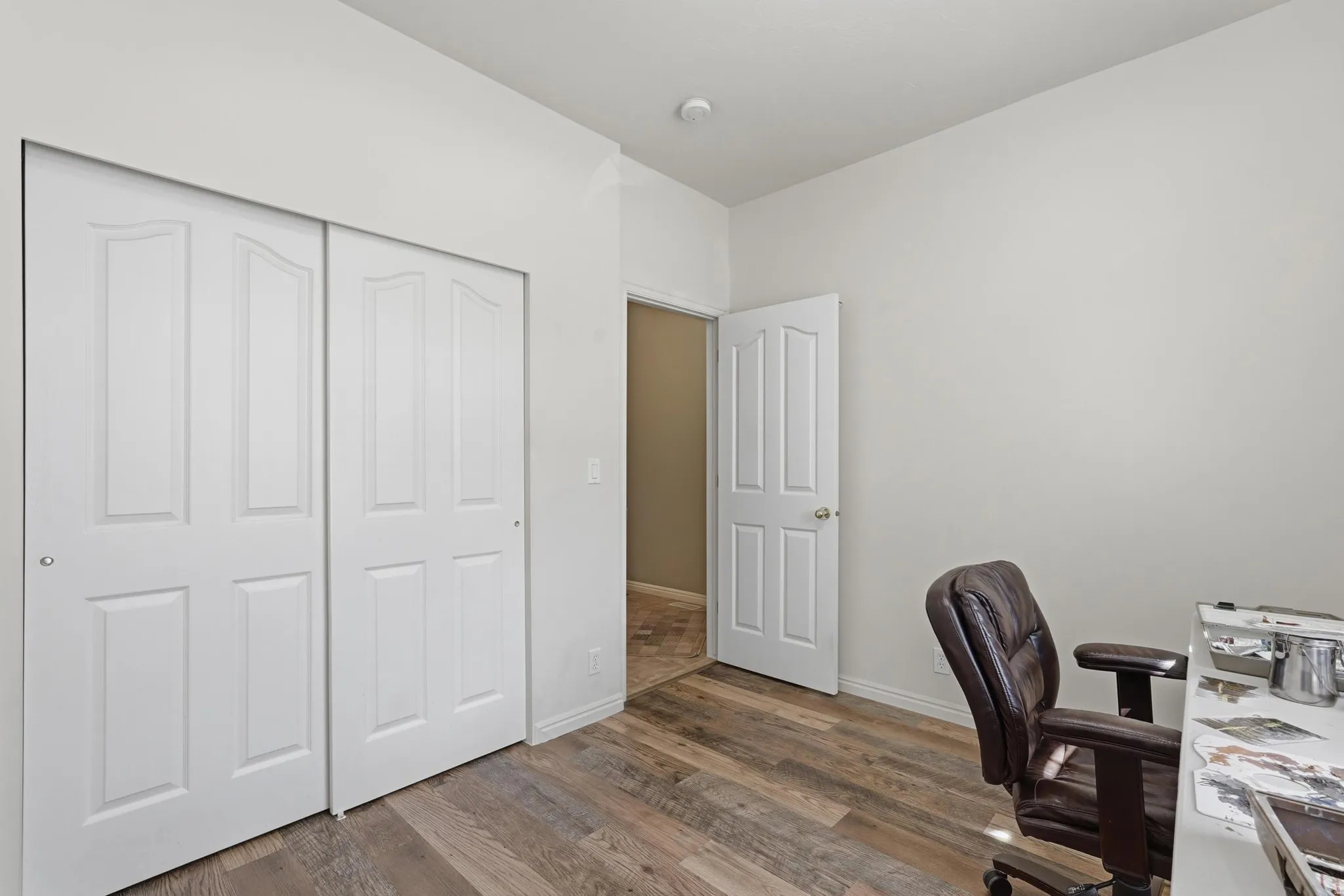 Second bedroom featuring LVP flooring and a closet