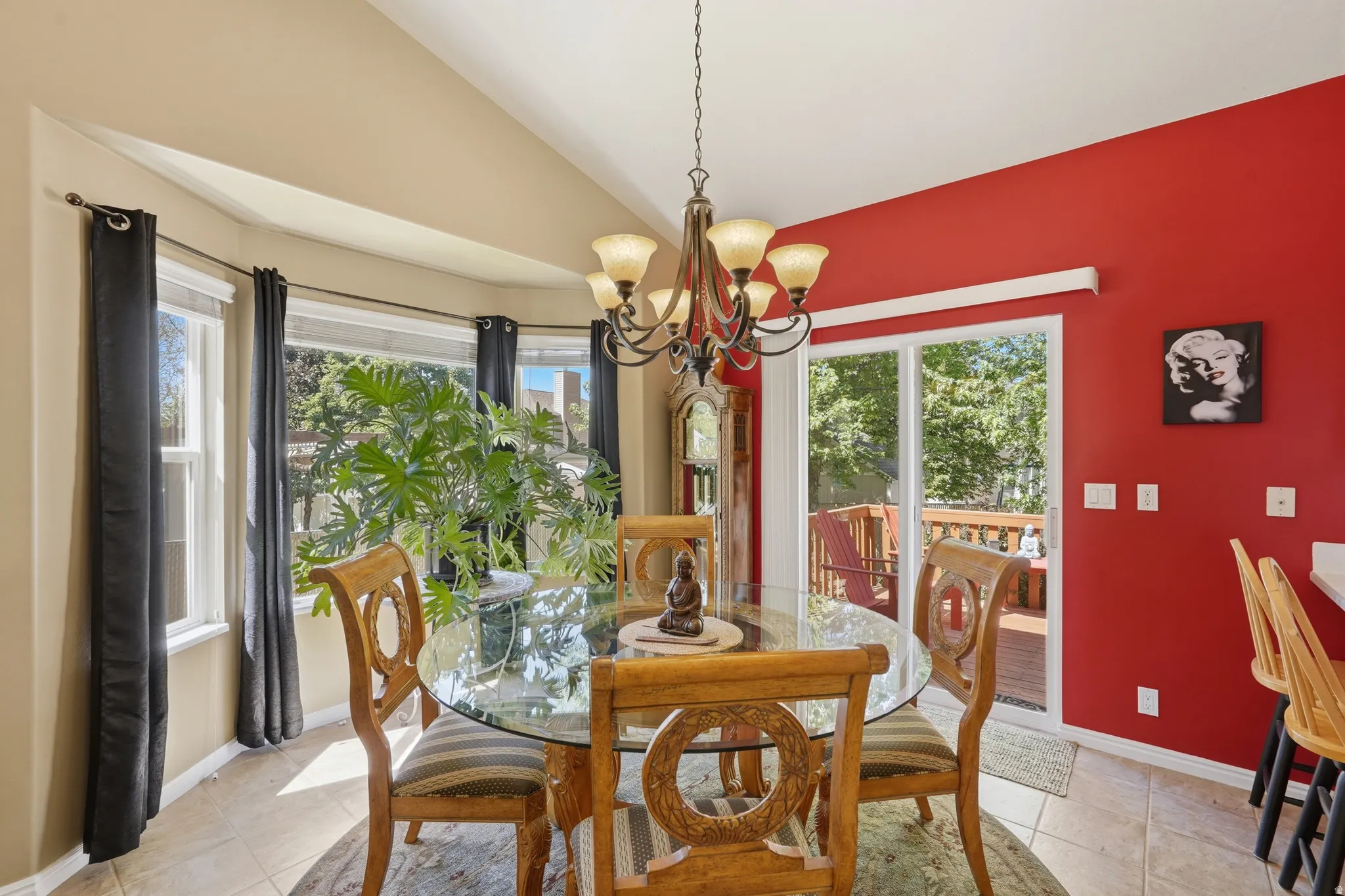 Dining area with tiled flooring and a bay window