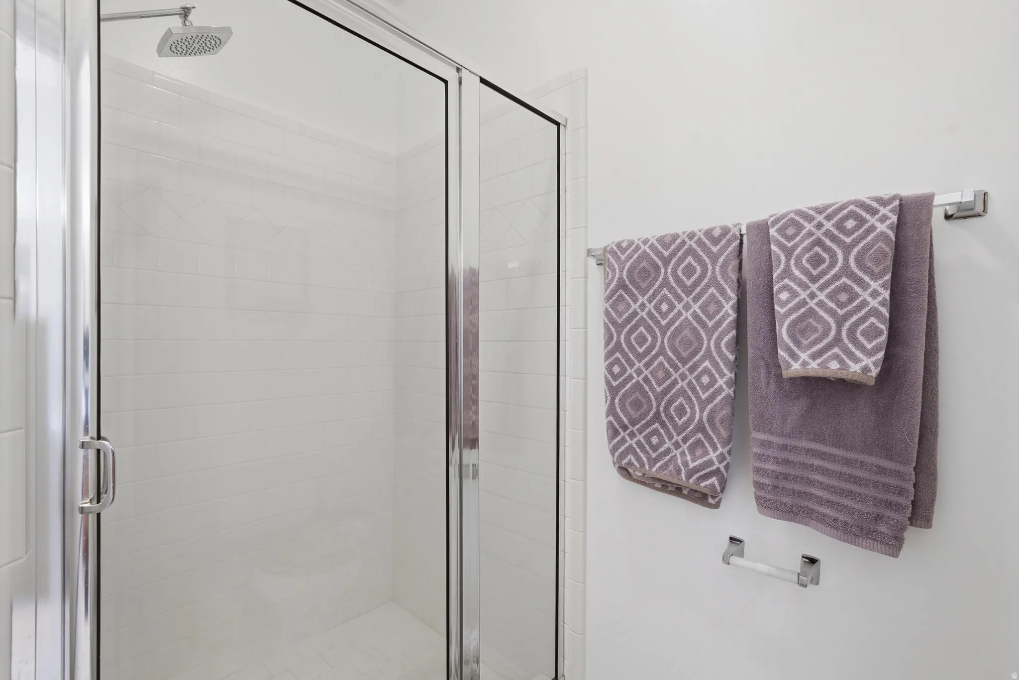 Separate en suite walk-in shower and toilet behind closed door.