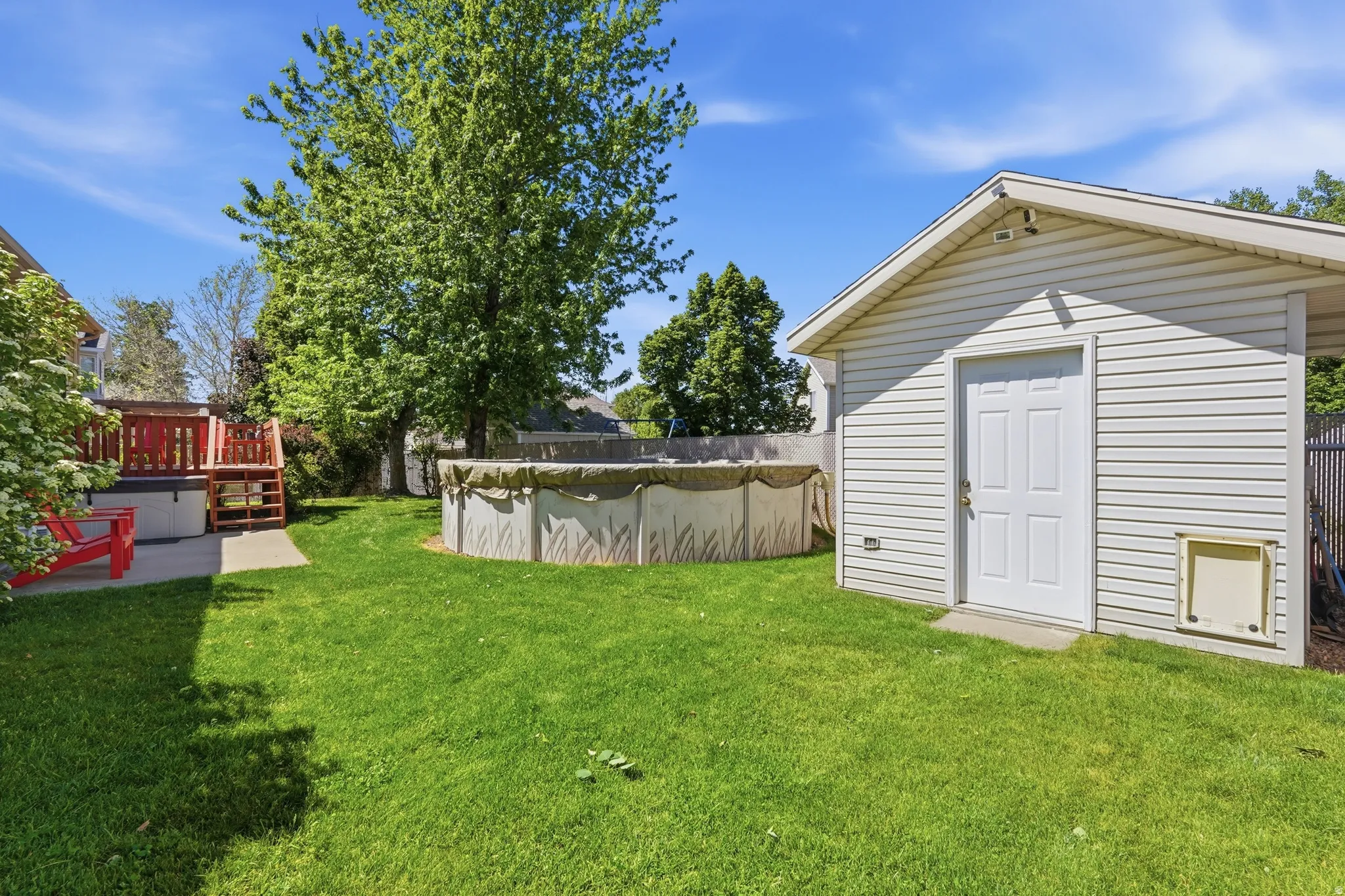 Storage shed with electric and a large above-ground pool