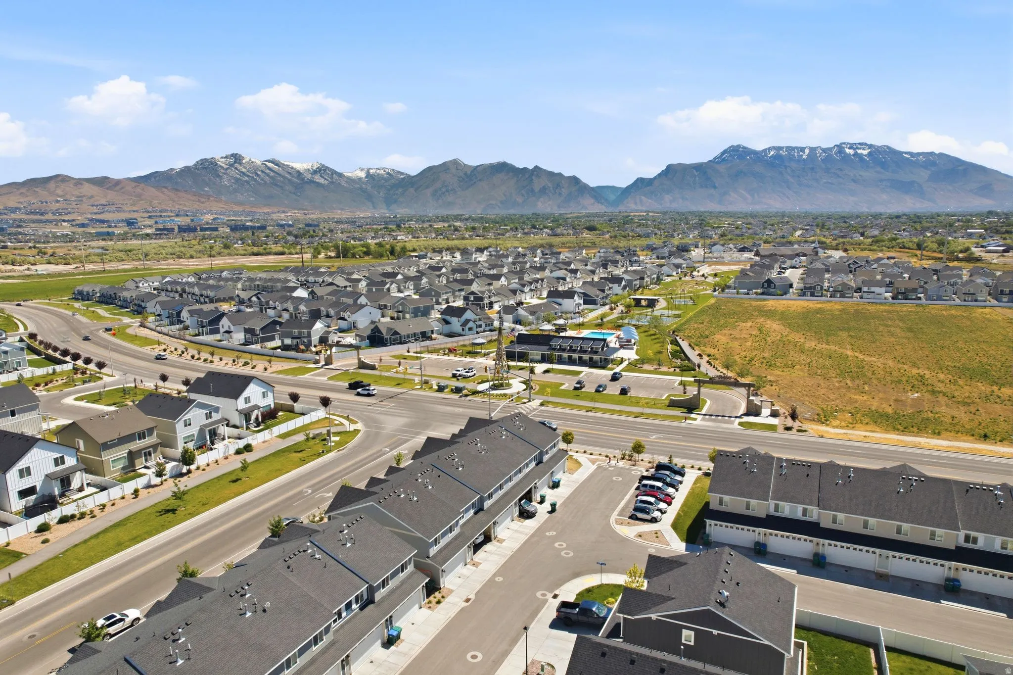 Newly developed residential community featuring a variety of housing types including single-family residences and townhomes