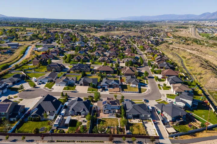 Expansive residential neighborhood featuring a variety of single-family homes, mature landscaping, and curved streets