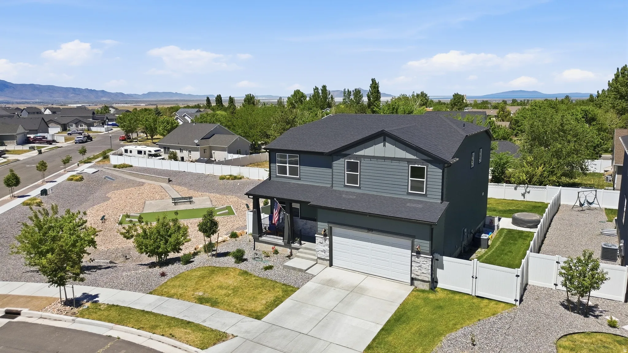Two-story residence with a two-car garage and stone accents