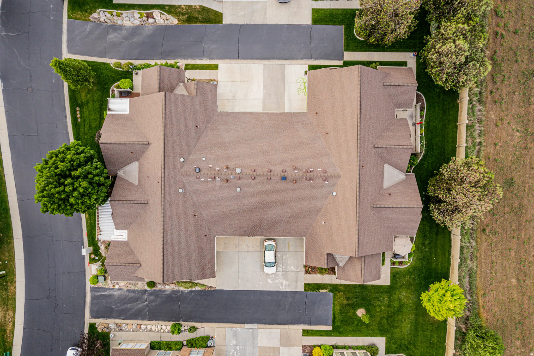 Brown shingle roofing with multiple gables