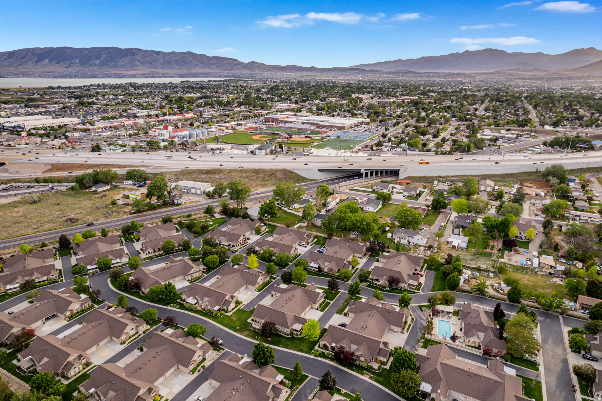 Aerial perspective showcasing a residential development with proximity to I-15