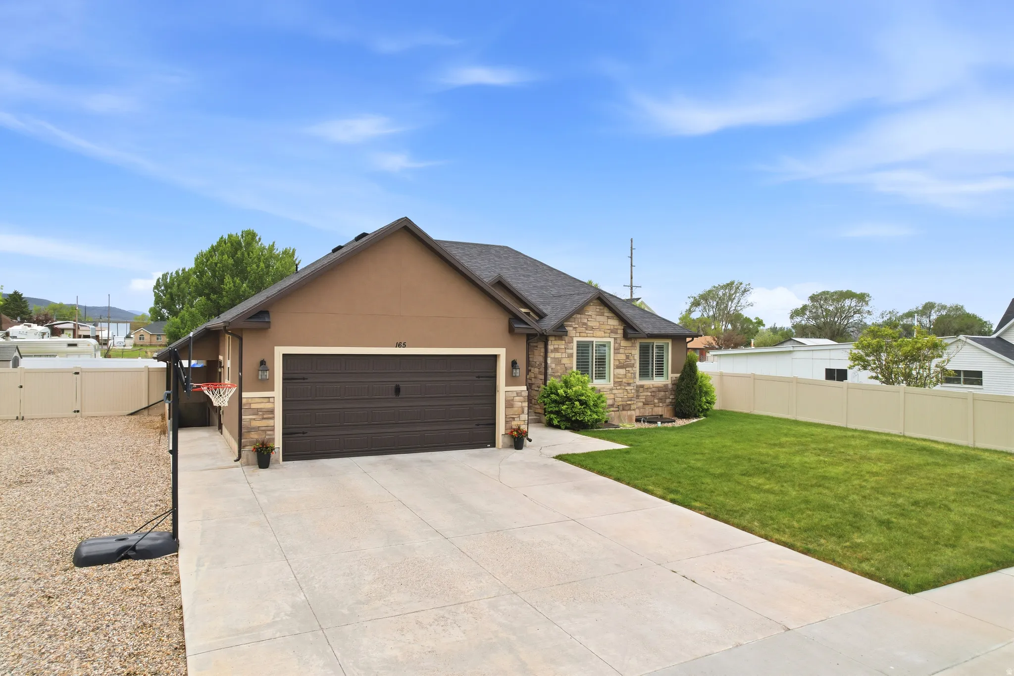 Contemporary exterior featuring stucco and stone accents